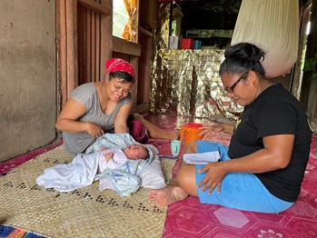 Lady and her baby receiving MDA on Taveuni Island